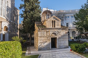 Fototapeta premium Byzantine style Church of Panagia Gorgoepikoos or Agios Eleftherios (Our Lady Who Grants Wishes Fast, XII century) in the heart of Athens at 8 Mitropoleos Square. Athens, Greece.