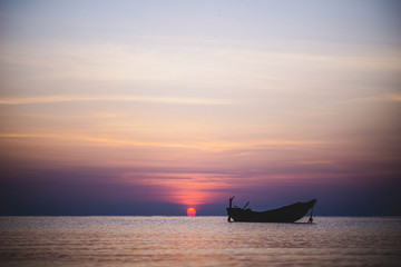 boat on the beach during sunrise in havelock andaman india