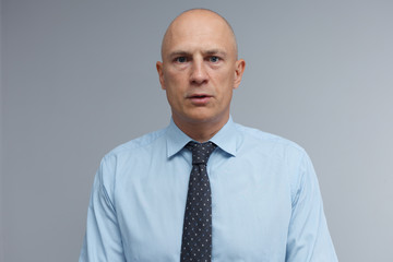 Portrait of a man in strict office clothes.