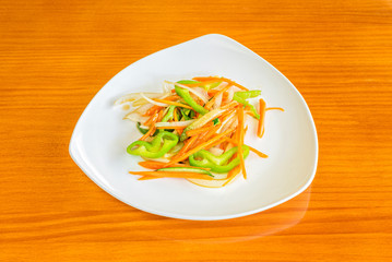 plate of assorted vegetables on wooden table