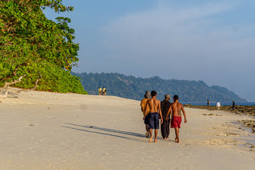 men walking on the beach