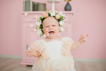 portrait of a little girl in a dress and flowers