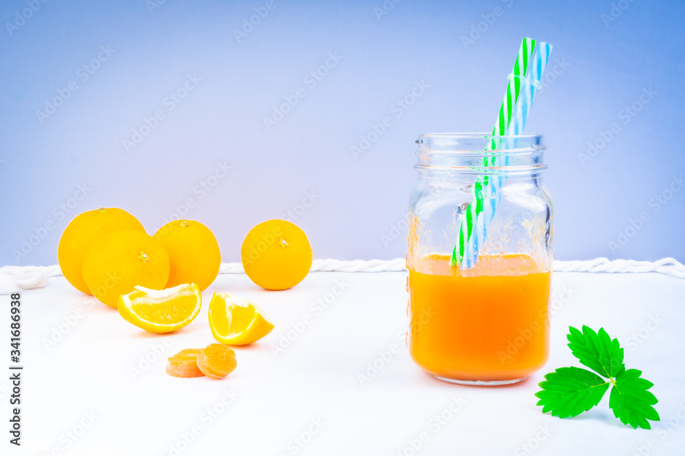 Poster carrot and orange juice with green leaf