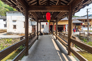 Chinese traditional red lanterns hanging in an old wooden gazebo 