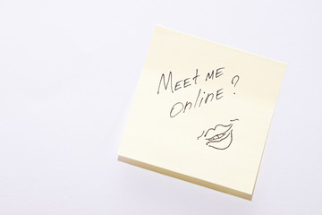 Text message, lettering. Meet me online and lettering lips with marker on sticker. Copy space