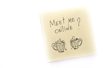 Two mugs of beer and the inscription Meet me online. Drawing with marker on sticker.