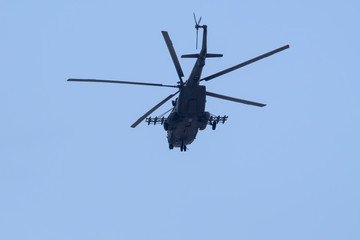 Fototapeta na wymiar Russian military helicopters against the blue sky.