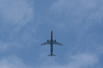 Time to travel. Passenger plane in the blue sky.