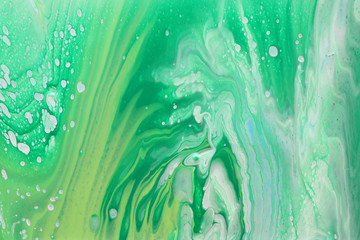 art photography of abstract marbleized effect background. Green, mint and white creative colors. Beautiful paint