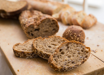 fresh loaf of bread on wooden board