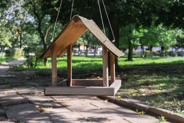 Empty bird feeder in city park as consequence curfew due to the coronavirus pandemic. Global problems of epidemic COVID 19