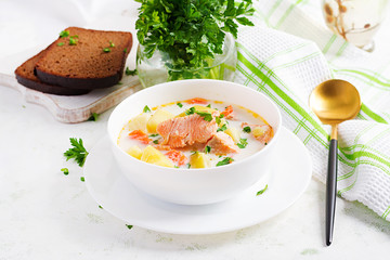 Kalakeitto. Creamy soup with salmon, potatoes, onions and carrots and  in a bowl. Finnish/ karelian...