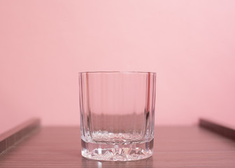 Cup on pink pastel background.
