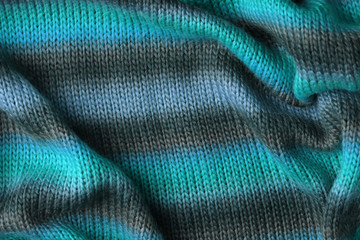 Knitted texture. Pattern fabric made of wool. Background, copy space. Handmade sweater texture, knitted wool pattern