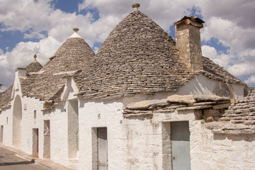 Fototapeta na wymiar The trulli of Alberobello is a traditional Apulian dry stone hut with a conical roof. Their style of construction is specific to the Itria Valley, in the Murge area of the Italian region of Apulia. 