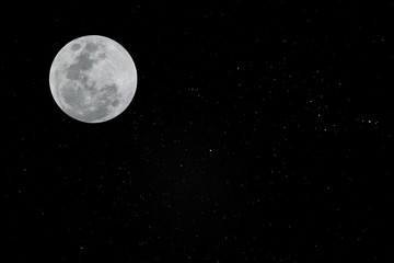Naklejka na ściany i meble Full moon in the dark sky with many real stars.