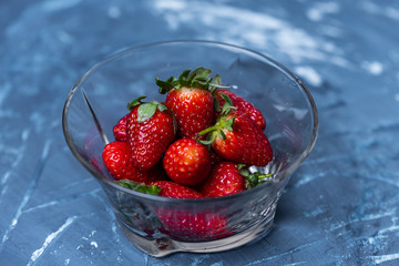 Strawberries in a transparent plate
