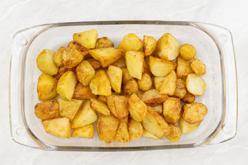 Top view Fried young potatoes in the glass dish
