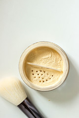 powder for woman face on white background