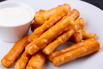 Cheese sticks, served with sour cream
