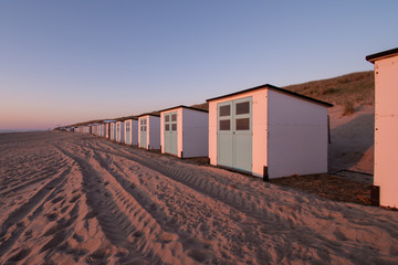 beach huts at sunset Texel