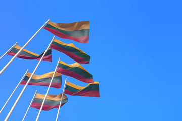 Lithuania flags waving in the wind against a blue sky. 3D Rendering