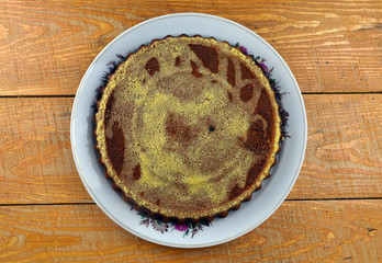 
fresh handmade cake lies in a plate on the table