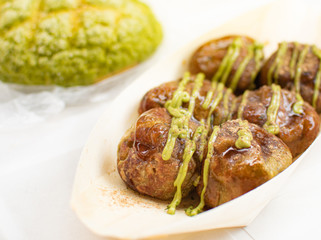 Takoyaki with Japanese Green tea cream sauce. Asia food.