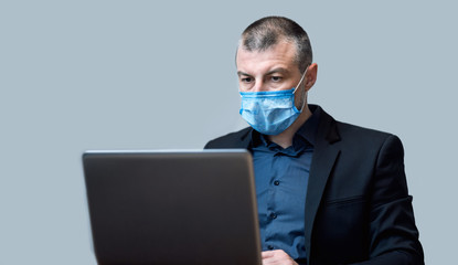 Entrepreneur Working Using Laptop Computer Wearing Protective Mask, Studio Shot