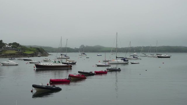 boats in the bay under mist