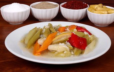 perfect turkish food leek spicy on white plate close up on wooden table