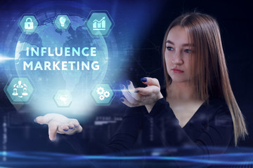 Business, Technology, Internet and network concept. Young businessman working on a virtual screen of the future and sees the inscription: Influence marketing