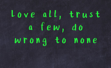 Black chalkboard with wise inscription on it