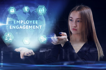 Business, Technology, Internet and network concept. Young businessman working on a virtual screen of the future and sees the inscription: Employee engagement