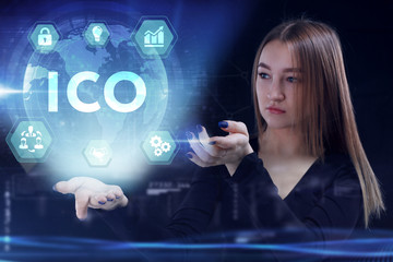 Business, Technology, Internet and network concept. Young businessman working on a virtual screen of the future and sees the inscription: ICO