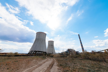 Cooling towers of a nuclear power plant in the back light