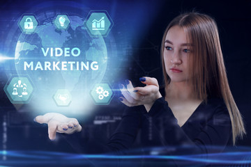 Business, Technology, Internet and network concept. Young businessman working on a virtual screen of the future and sees the inscription: Video marketing