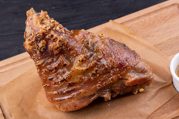 Rolls baked in an oven with spices are served with mustard