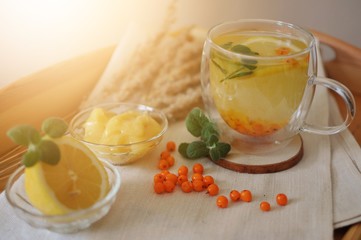 Healthy drink against viruses - buckthorn tea with mint, lemon and honey.