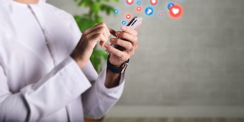 Close-up image of Arabic male hands using smartphone, Man typing the messages on social network.