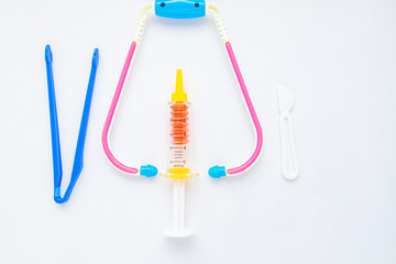 Children's set for a doctor, top view. Place for text. Kids toys