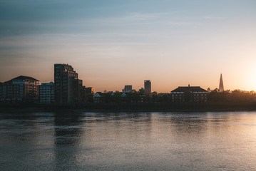 Sunset by the river and skyscrapers