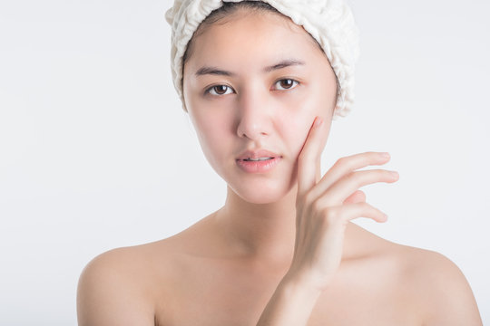 Beautiful young women teens Asia applying hand cream on white background Portrait of an Attractive girl with sugar eyes, close up.