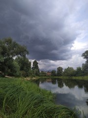 storm clouds over the river