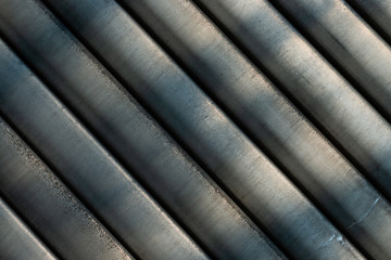 Grey horizontal slats of an industrial roller shutter (abstract detail)