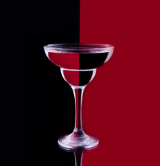 Cocktail glass on a red-black background