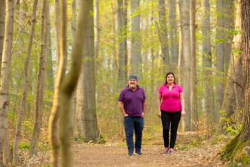 Couple Walking together far deep in the forest.