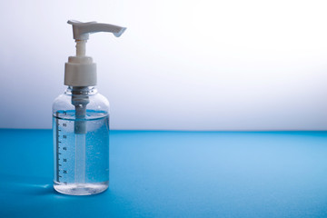 Coronavirus prevention , Bottle of hand sanitizer alcohol gel - Blue background 1