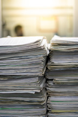Stacks of paper files work desk office, business report papers,piles of unfinished documents achieves, Business concept.