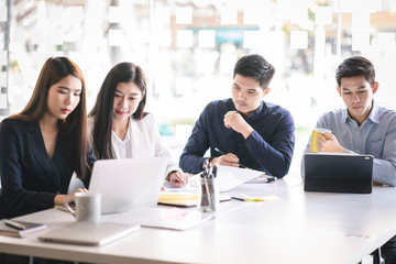 Business team discussing together in conference room during meeting at office. Teamwork, brainstorm and ideas concept. saleperson using tablet and presentation somthing to client.